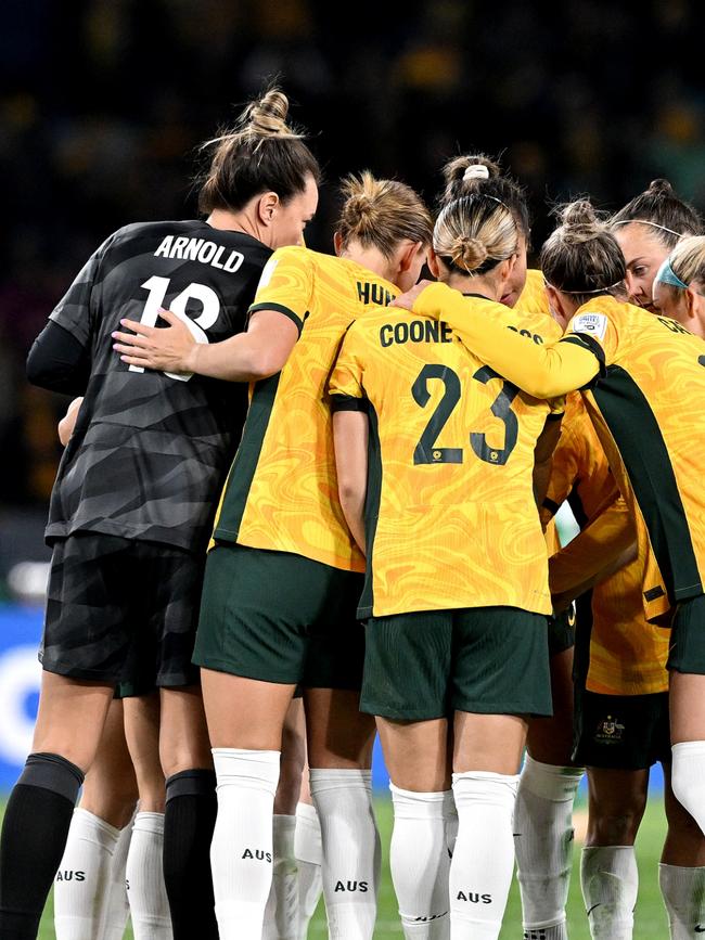 The players embracing. Photo by Bradley Kanaris/Getty Images