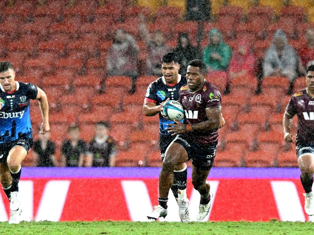 The Reds prevailed in the wet against the Melbourne Rebels. Picture: Bradley Kanaris/Getty Images