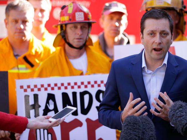 Opposition leader Matthew Guy with volunteer CFA firefighters in June last year. Picture: Darrian Traynor