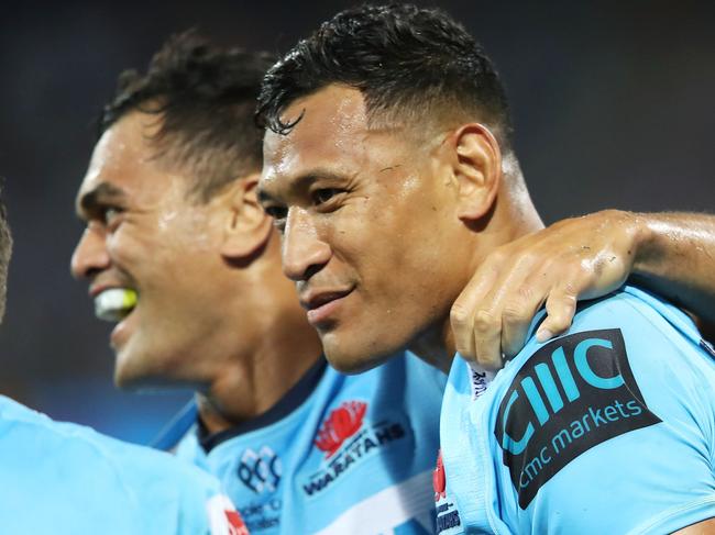 SYDNEY, AUSTRALIA - MARCH 23: Karmichael Hunt and Israel Folau of the Waratahs celebrate Folau scoring a try during the round six Super Rugby match between the Waratahs and the Crusaders on March 23, 2019 in Sydney, Australia. (Photo by Mark Kolbe/Getty Images)