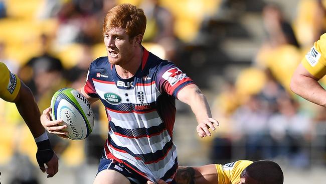 WELLINGTON, NEW ZEALAND - MARCH 04: Nic Stirzaker of the Melbourne Rebels is tackled by TJ Perenara of the Hurricanes during the round two Super Rugby match between the Hurricanes and the Rebels at Westpac Stadium on March 4, 2017 in Wellington, New Zealand. (Photo by Mark Tantrum/Getty Images)