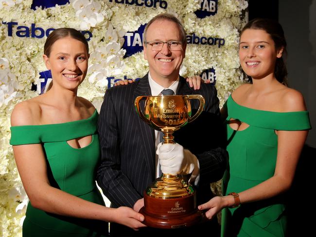 David Attenborough holding the Melbourne Cup