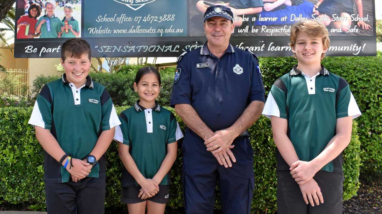 LOCAL COP: Dalby South State School's adopted police officer Sgt Brett Hunter with Tai Phipps, Monika Stritzel and Joseph Routley.