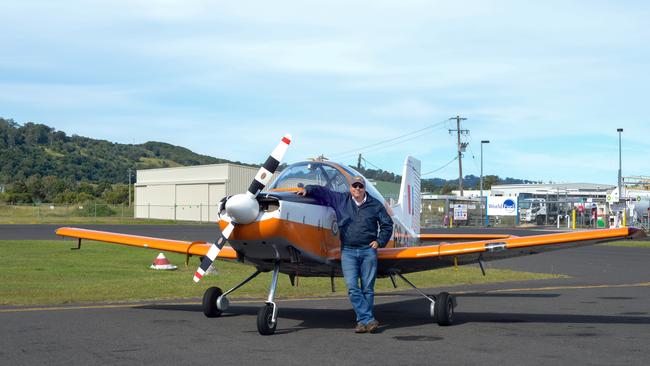 FLYING PAROTS: Gary Herne with his brightly painted CT-4 basic trainer, in which a generation of Australian Defence Force (ADF) pilots made a first, anxious solo flight.