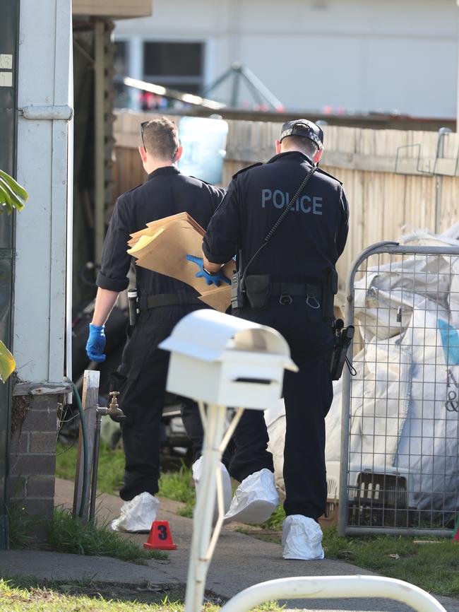 Forensic officers at both Merrylands