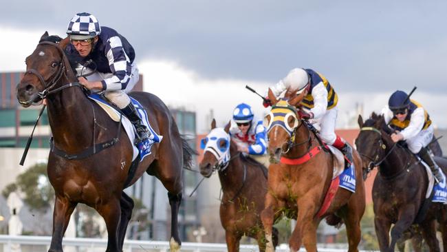 Russian Camelot, ridden by Damien Oliver, takes out the Underwood Stakes.