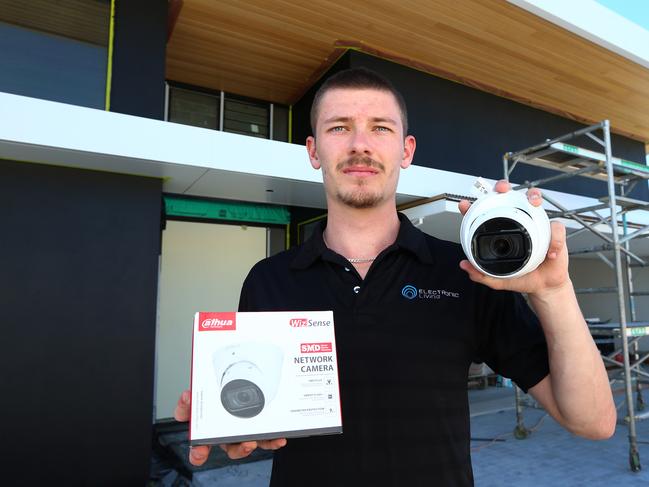 Jacob Nicholson from Electronic Living installing security cameras at a property in Cleveland. Friday 28th July 2023 Picture David Clark