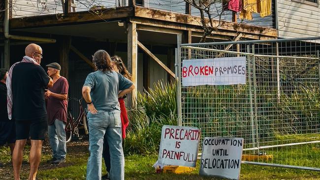 Northern Rivers residents unable to find secure accommodation who are now squatting in a buyback home in North Lismore want to remain in the home until it is relocated off the flood plain, despite threats of police involved eviction.