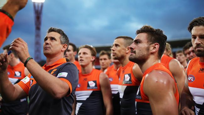 Brett Deledio and Stephen Coniglio listen to coach Leon Cameron during a game a few seasons ago. Picture: Phil Hillyard