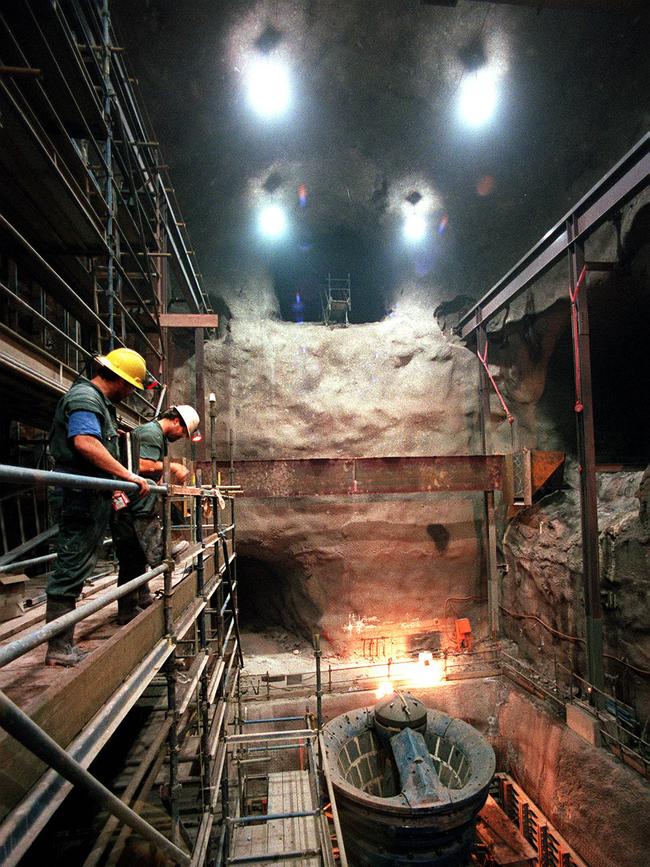 Construction workers look down on the ore crusher deep inside the Olympic Dam mine in 1997.