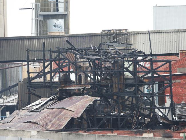 Daylight reveals significant damage to the factory. Picture: David Crosling