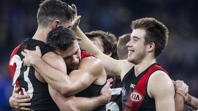 Essendon players celebrate their win against West Coast in Perth. Picture: AAP Image/Tony McDonough