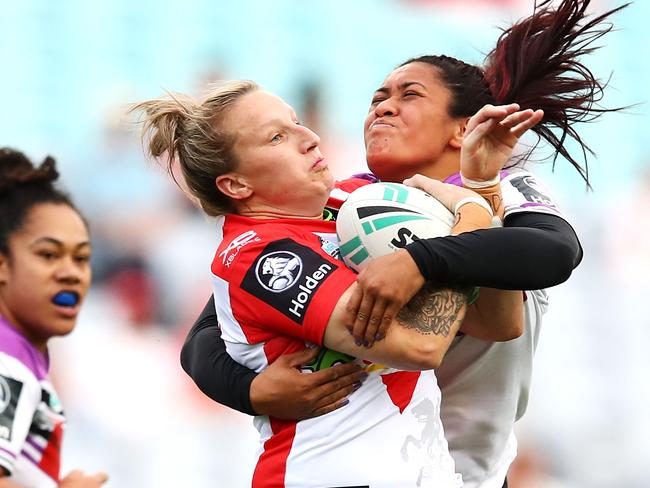 Holli Wheeler is tackled Crystal Tamarua during the Dragons/Warriors match.