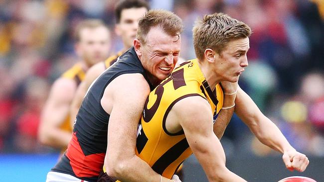 Harry Morrison gets a handball away in front of Brendon Goddard. Pic: Getty Images