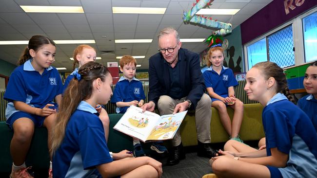 Prime Minister Anthony Albanese reading a book with students at Stuart Park Primary in Darwin, after announcing a $1 billion funding deal for public schools in the Northern Territory. Picture: NCA NewsWire / Lukas Coch