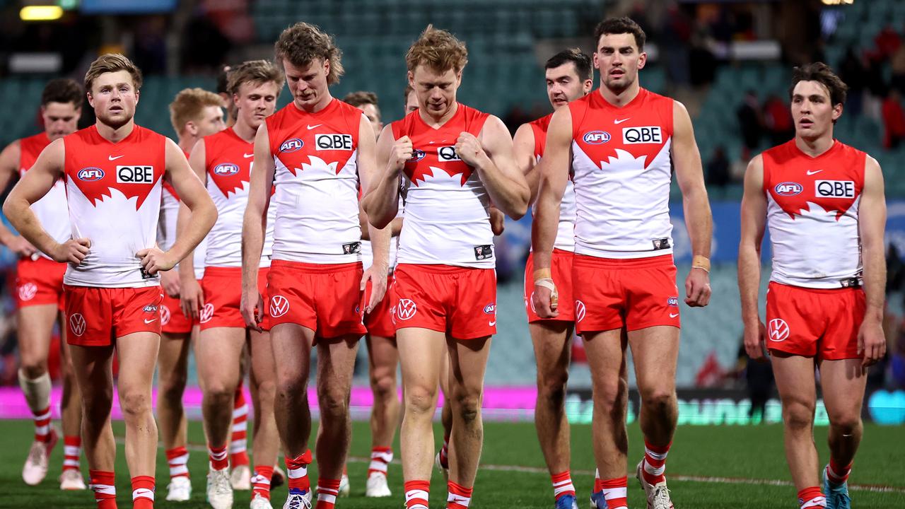 SYDNEY, AUSTRALIA - JULY 28: Swans players react at full-time as they leave the field during the round 20 AFL match between Sydney Swans and Western Bulldogs at SCG, on July 28, 2024, in Sydney, Australia. (Photo by Brendon Thorne/AFL Photos/via Getty Images)