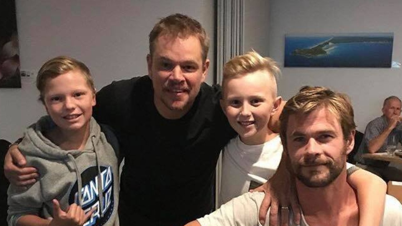 Hollywood celebrities Chris Hemsworth and Matt Damon with two young and very chuffed diners at Rainbow on the NSW north coast. Picture: Supplied