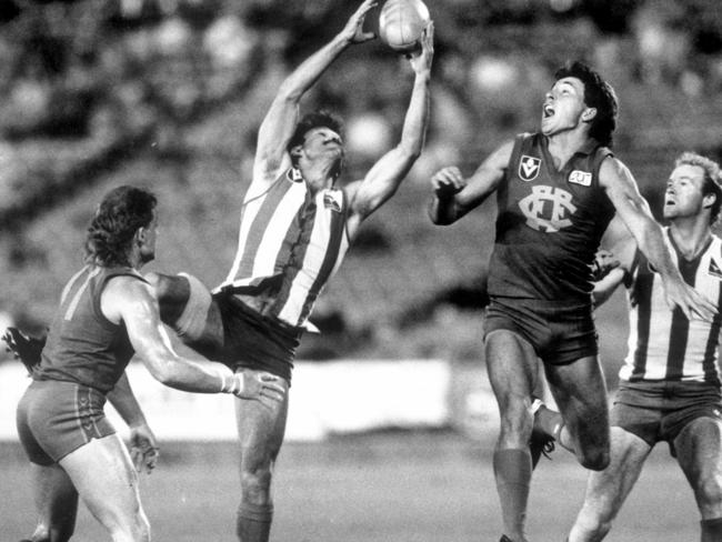 Andrew Demetriou pulls in a mark during his playing days for North Melbourne.