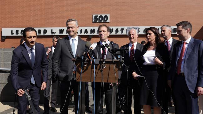 Dominion Voting Systems CEO John Poulos second left, lawyers Justin Nelson, third left, Davida Brook, third right, and Stephen Shackelford, right, speak to the press after a settlement was been reached outside the Leonard Williams Justice Center where Dominion was suing Fox News for defamation.