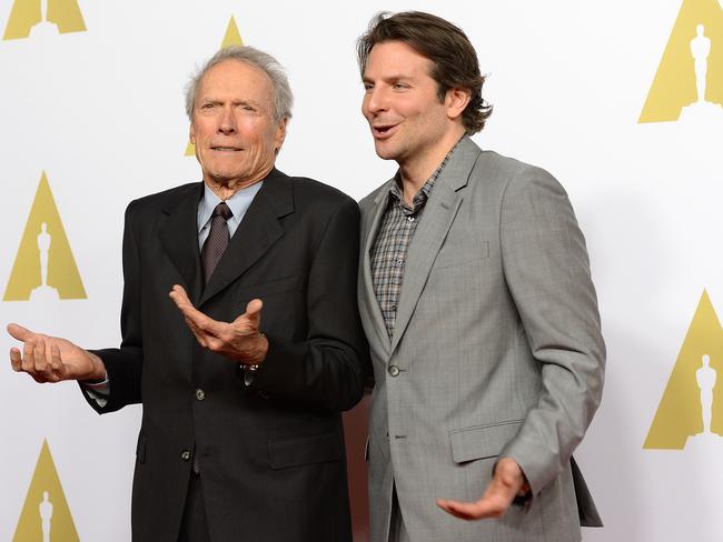 War, what is it good for? ... Awards, ticket sales and controversy. Director Clint Eastwood with Bradley Cooper. Picture: AFP/Robyn Beck