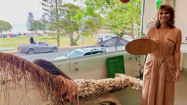 Commonwealth Games medal designer artist Delvene Cockatoo-Collins with a shell mermaid piece at her North Stradbroke Island studio. Picture: Supplied