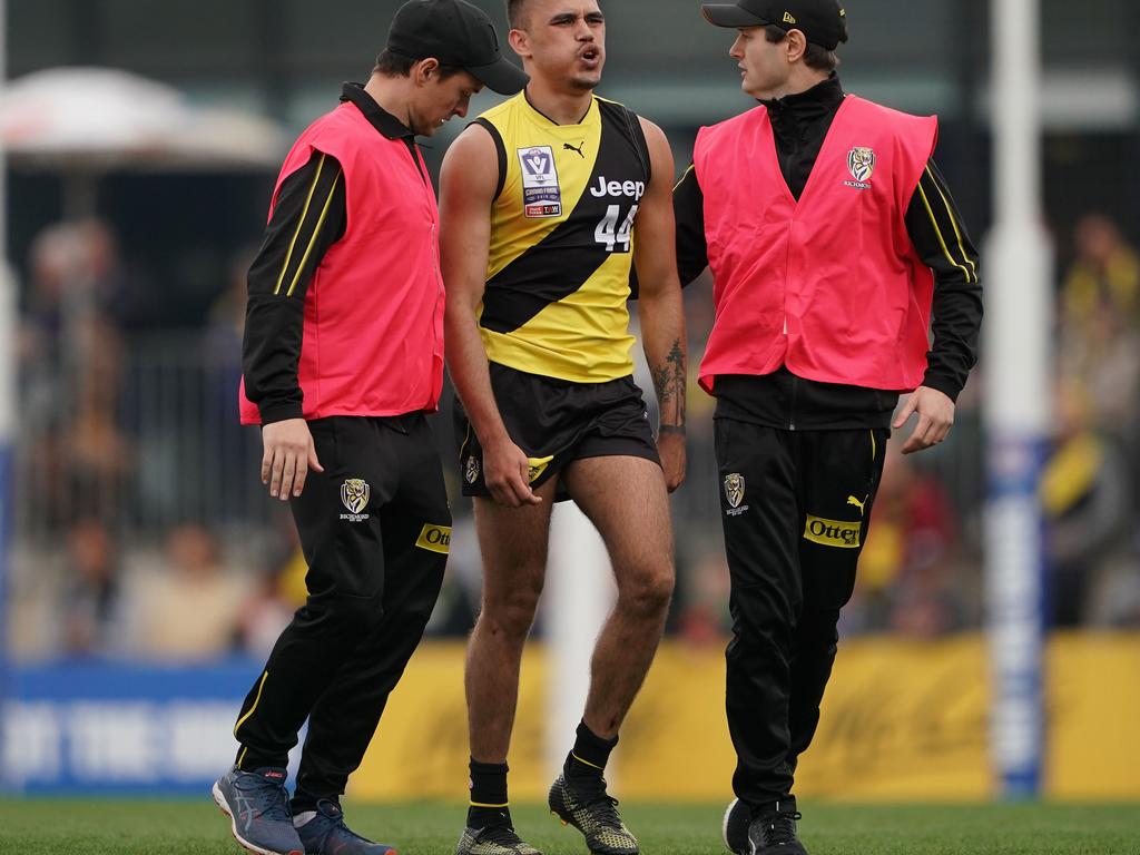 Sydney Stack leaves the field injured during the VFL Grand Final.