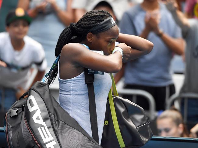 Coco Gauff of the US walks off the court after losing against Sofia Kenin of the US during their women's singles match on day seven of the Australian Open tennis tournament in Melbourne on January 26, 2020. (Photo by John DONEGAN / AFP) / IMAGE RESTRICTED TO EDITORIAL USE - STRICTLY NO COMMERCIAL USE