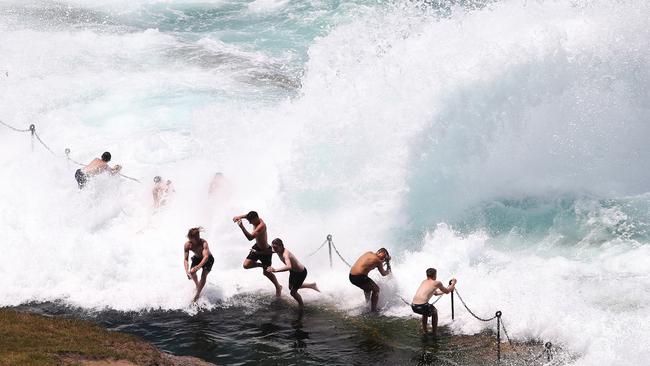 A group of boys doing their best to keep cool at Bogey Hole in Newcastle. Picture: Peter Lorimer