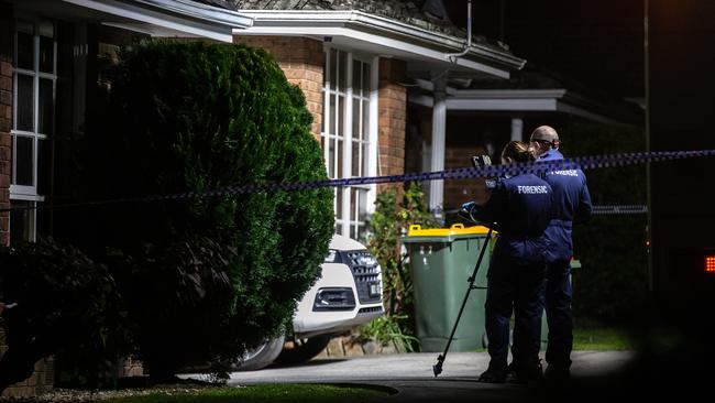 Forensic police at the property where two people were found dead. Picture: Sarah Matray