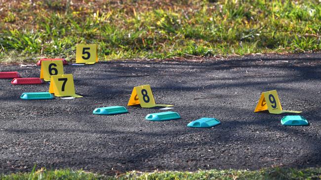 Police markers at the crime scene at Frascott Park in Varsity Lakes. Picture: AAP.