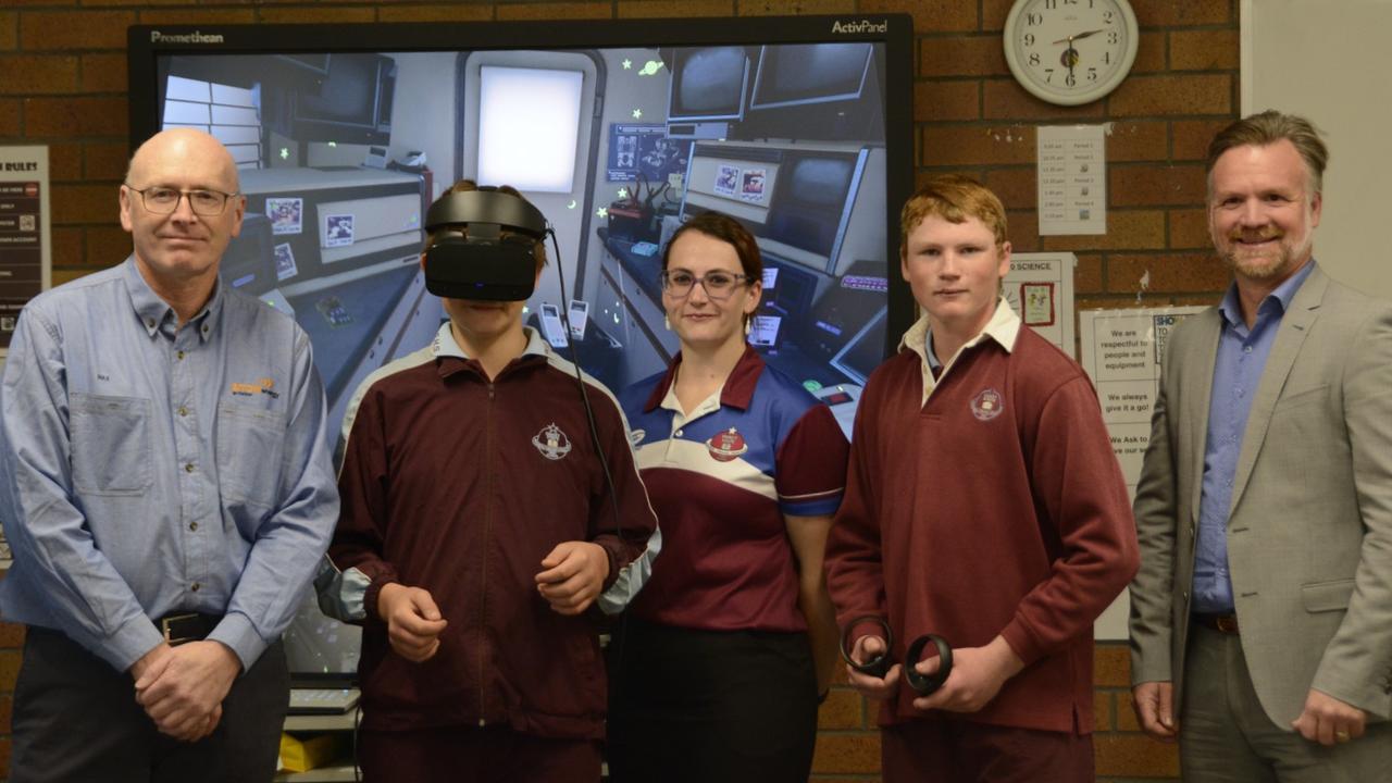 Arrow Energy production manager Max Murray, Oakey State High School student Wayne Gemmell, special needs teacher Jess Daniells, student Jakob Webber and Arrow Energy service design implementation partner Stewart Kopick at the school's virtual learning hub.