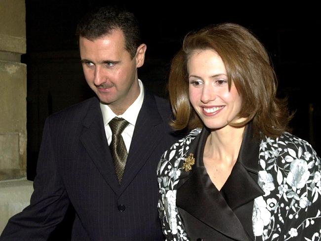 (FILES) Syrian ousted president Bashar al-Assad and his wife Asma arrive for a dinner hosted by Britain's Lord Chancellor, Lord Irvine of Lairg, at Lancaster house in central London 16 December 2002. Once seen as an advocate of women's rights in the Middle East, Syria's British-born former first lady Asma al-Assad has fled into exile with her husband, with UK officials saying she is not welcome home. (Photo by NICOLAS ASFOURI / POOL / AFP)