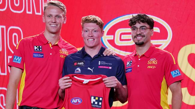 No. 1 pick Matt Rowell with new teammates Jack Lukosius, left, and Izak Rankine. Picture: Michael Dodge/AAP