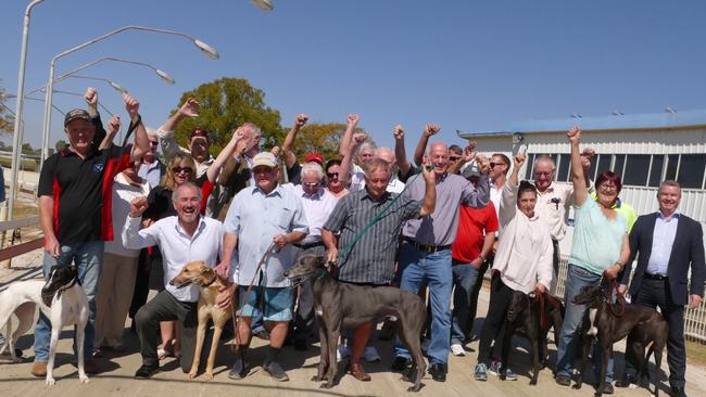 Clarence MP Chris Gulaptis, seated third from left, gets a cheer from local greyhound racing supporters at the announcement of a $4.6 million grant to refurbish the Grafton Greyhound track in 2019.