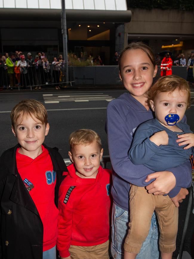 Thousands of people have braved the rain to gather in Brisbane for Anzac Day services. Picture: Grace Kessels