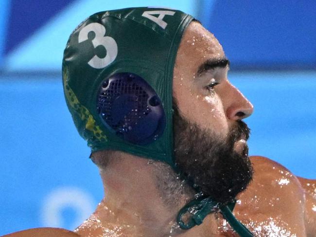 Australia's #03 Milos Maksimovic shoots the ball in the men's water polo preliminary round group B match between France and Australia during the Paris 2024 Olympic Games at the Aquatics Centre in Saint-Denis, north of Paris, on August 1, 2024. (Photo by Andreas SOLARO / AFP)