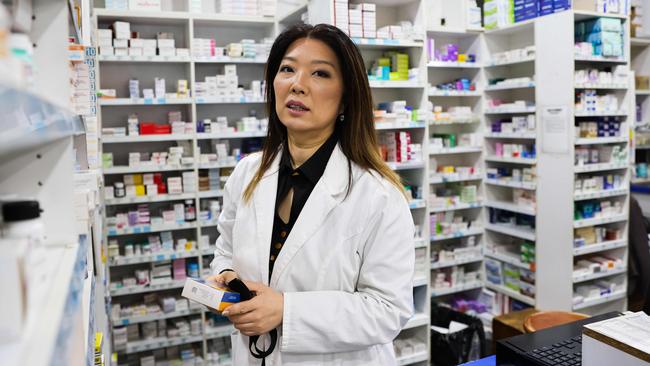 Pharmacist Angela Song, in Sydney’s inner southwest, says she is longing to vaccinate her multicultural customers but the authorities won’t let her. Picture: Ryan Osland