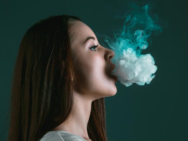 The face of vaping young woman on black studio backgroundIStock imageCredit:master1305 Stock photo ID:687438202Upload date:May 24, 2017