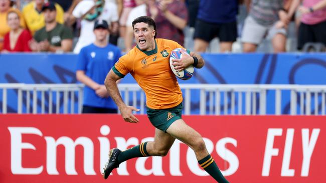 PARIS, FRANCE - SEPTEMBER 09: Ben Donaldson of Australia breaks forward to score his side's third try during the Rugby World Cup France 2023 match between Australia and Georgia at Stade de France on September 09, 2023 in Paris, France. (Photo by Warren Little/Getty Images)