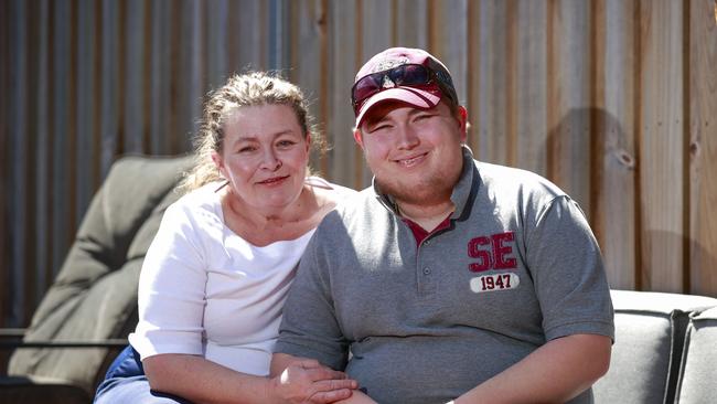 Donna Bartho-Jones with her son Jake Jones, 20, who lives with multiple disabilities, at home in Narraweena. Picture: Justin Lloyd.