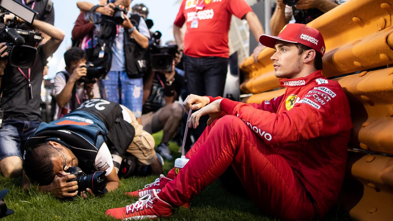 Pole-sitter Charles Leclerc was surrounded by photographers as he focused on his pre-race ritual.