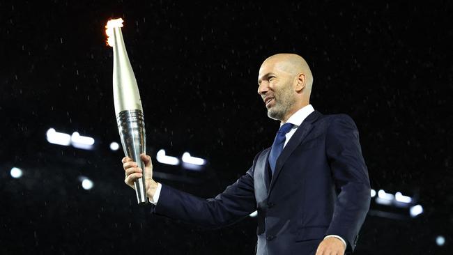 Torchbearer Zinedine Zidane is seen during the opening ceremony. (Photo by Stephanie Lecocq / POOL / AFP)