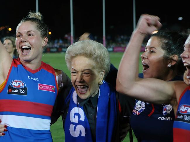 Susan Alberti sings the team song with Western Bulldogs players after their historic Round 1 win in the AFLW. Picture: Wayne Ludbey