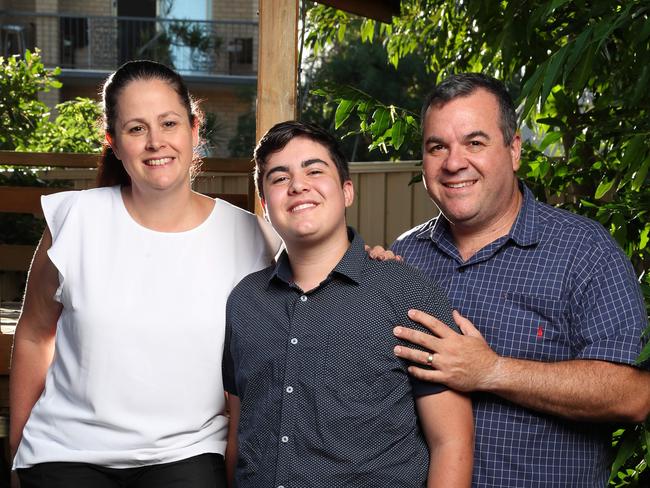 17 year old Nate Musiello of Redcliffe who has successfully undergone gender reassignment surgery from female to male with his mum Michelle Suters and dad Gabriel Musiello.  Photo Lachie Millard