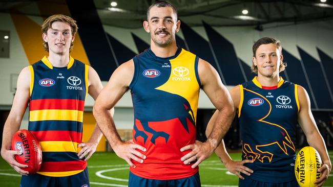 Max Michalanney, Taylor Walker and Jake Soligo in the Crows' guernsey range for 2024.