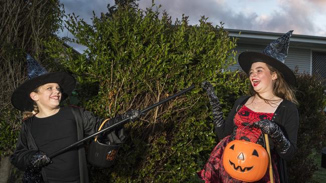 Hannah Paton (left) and Elodie Fairbanks-Smith trick or treating on Halloween in Newtown, Sunday, October 31, 2021. Picture: Kevin Farmer