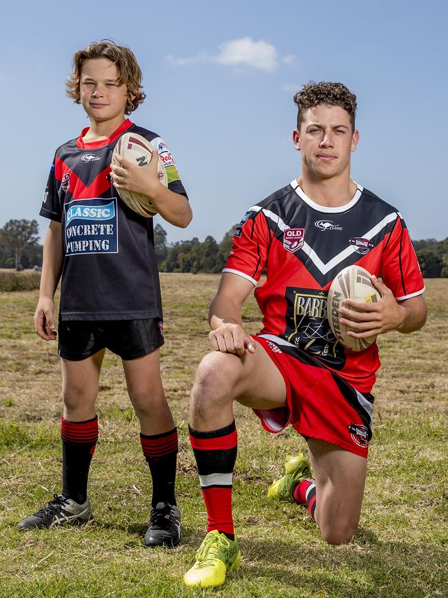 Mudgeeraba Redbacks junior Cooper Raven, 11, with halfback Kyle Williams. Picture: Jerad Williams