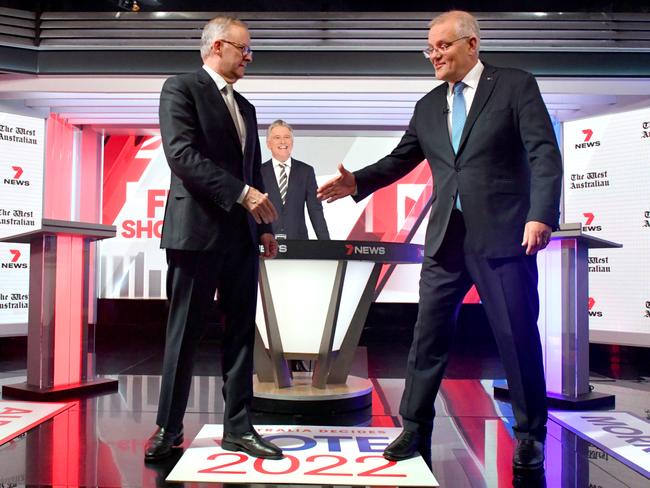 Australian Prime Minister Scott Morrison and Australian Opposition Leader Anthony Albanese shake hands during the third leaders' debate at Seven Network Studios on Day 31 of the 2022 federal election campaign, in Sydney, Wednesday, May 11, 2022. (AAP Image/Mick Tsikas) NO ARCHIVING