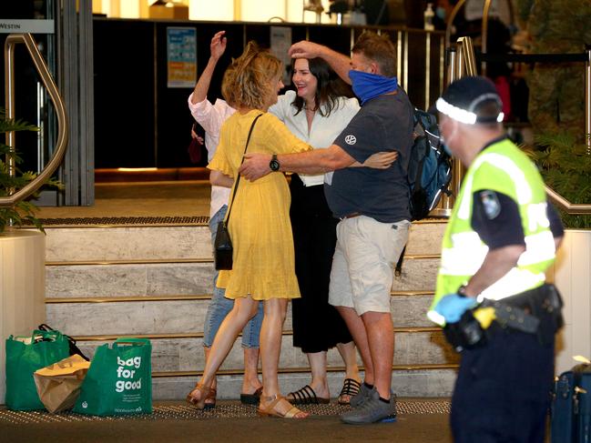 Geoff and Kaz Crooks are meet by their daughters Jasi and Elyssa. Picture: David Clark