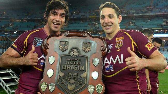 Queensland stars Johnathan Thurston and Billy Slater celebrate a State of Origin triumph.